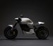 white and black motorcycle with black background